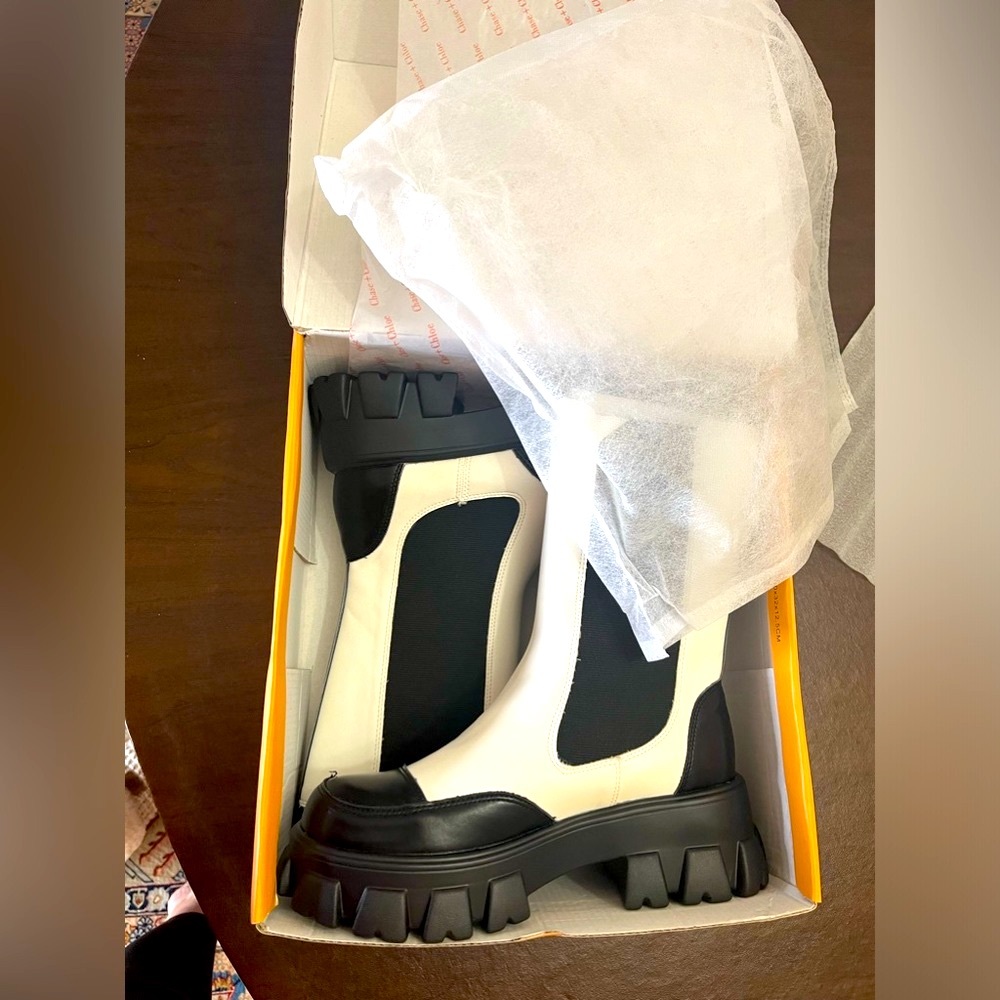 BRAND NEW IN THE BOX NEVER USED Chelsea boot lifted with a lugged platform heel.